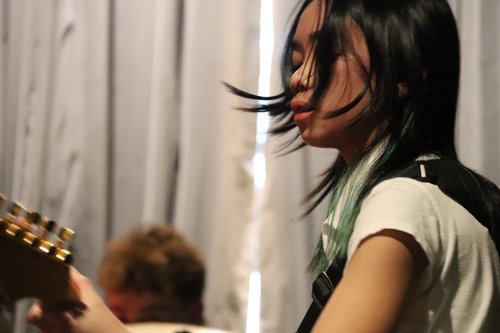 Guitarist mid-song at a live show