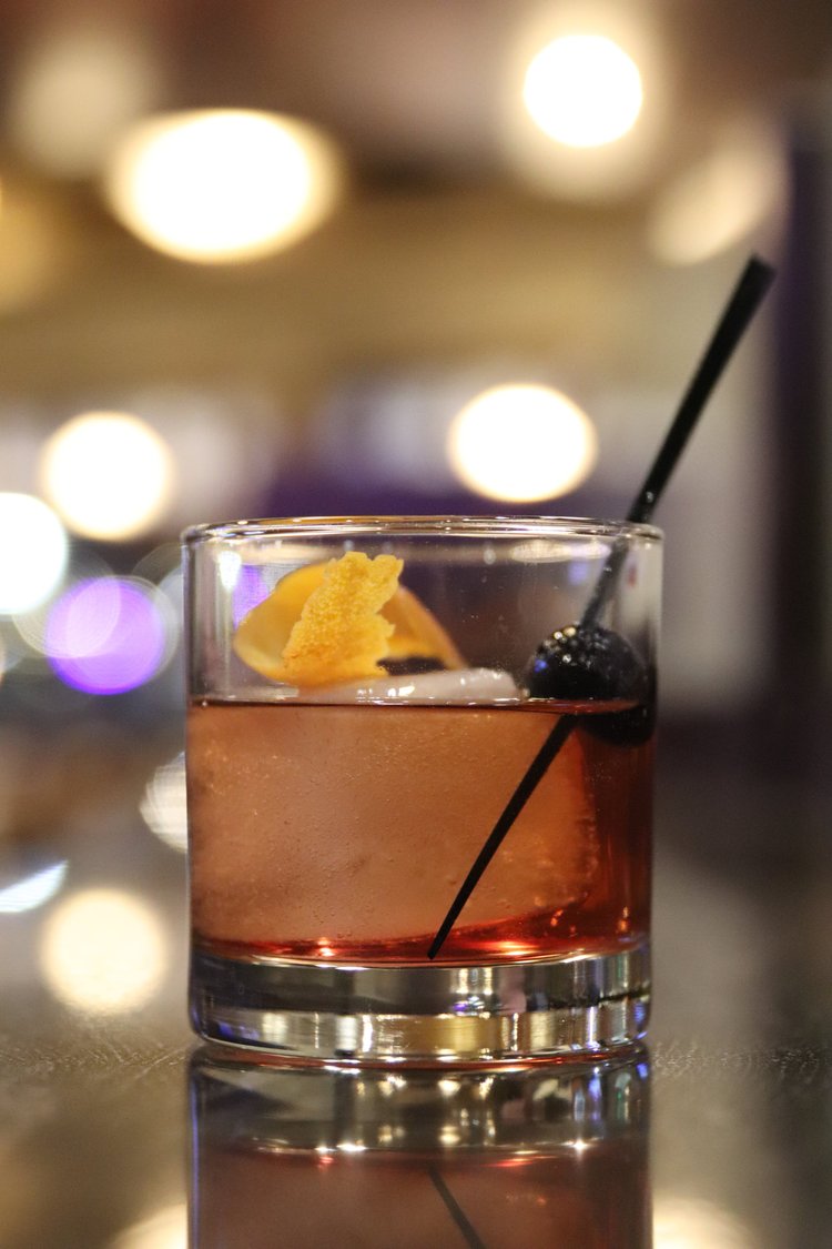 Old fashioned cocktail photographed at the bar